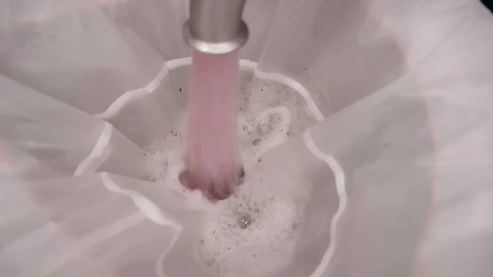 Recirculation flow carrying resin-rich wash water into the collection bag.