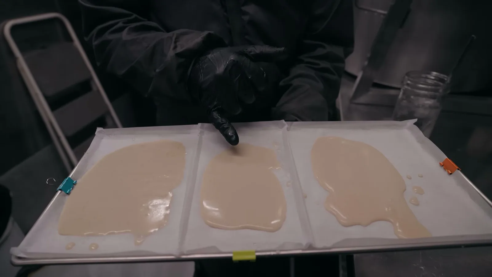 Melt fractions laid out side by side on trays for grading.