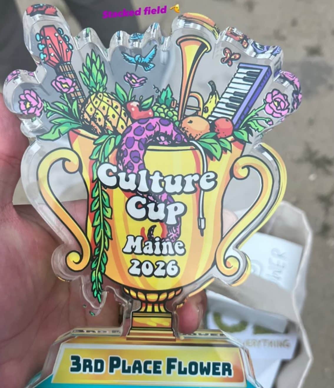 Culture Cup Maine 2026 third-place flower trophy held up at the event