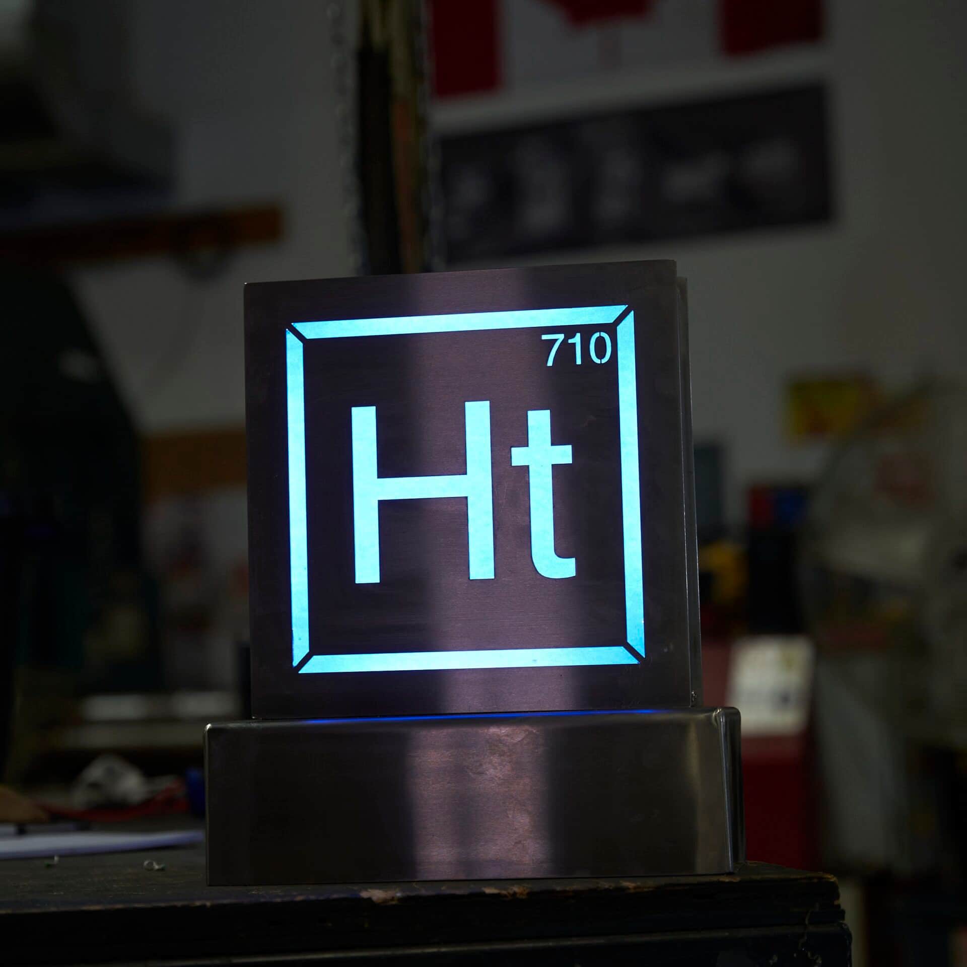 An illuminated Hashtek sign made in the fabrication shop